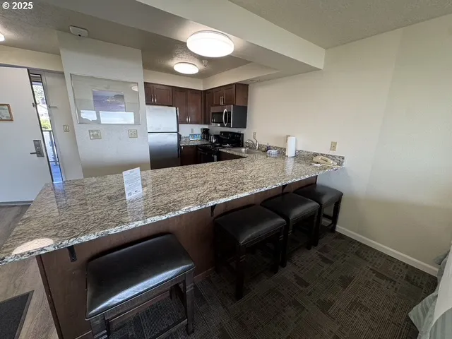 a kitchen with counter space cabinets and appliances