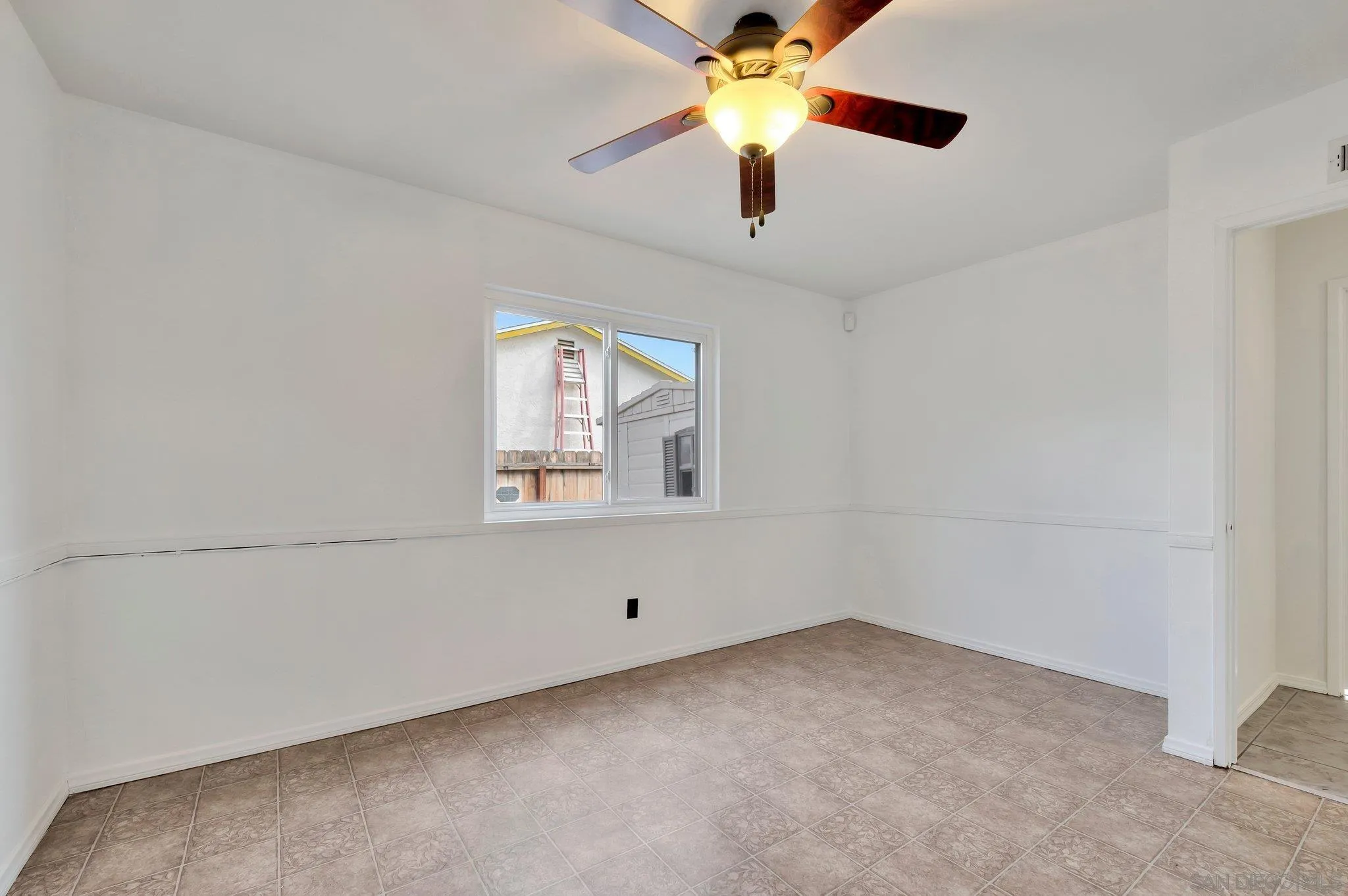 9183 Via De Amor Santee, CA 92071 - Photo 18 of 32 an empty room with a window and a fan