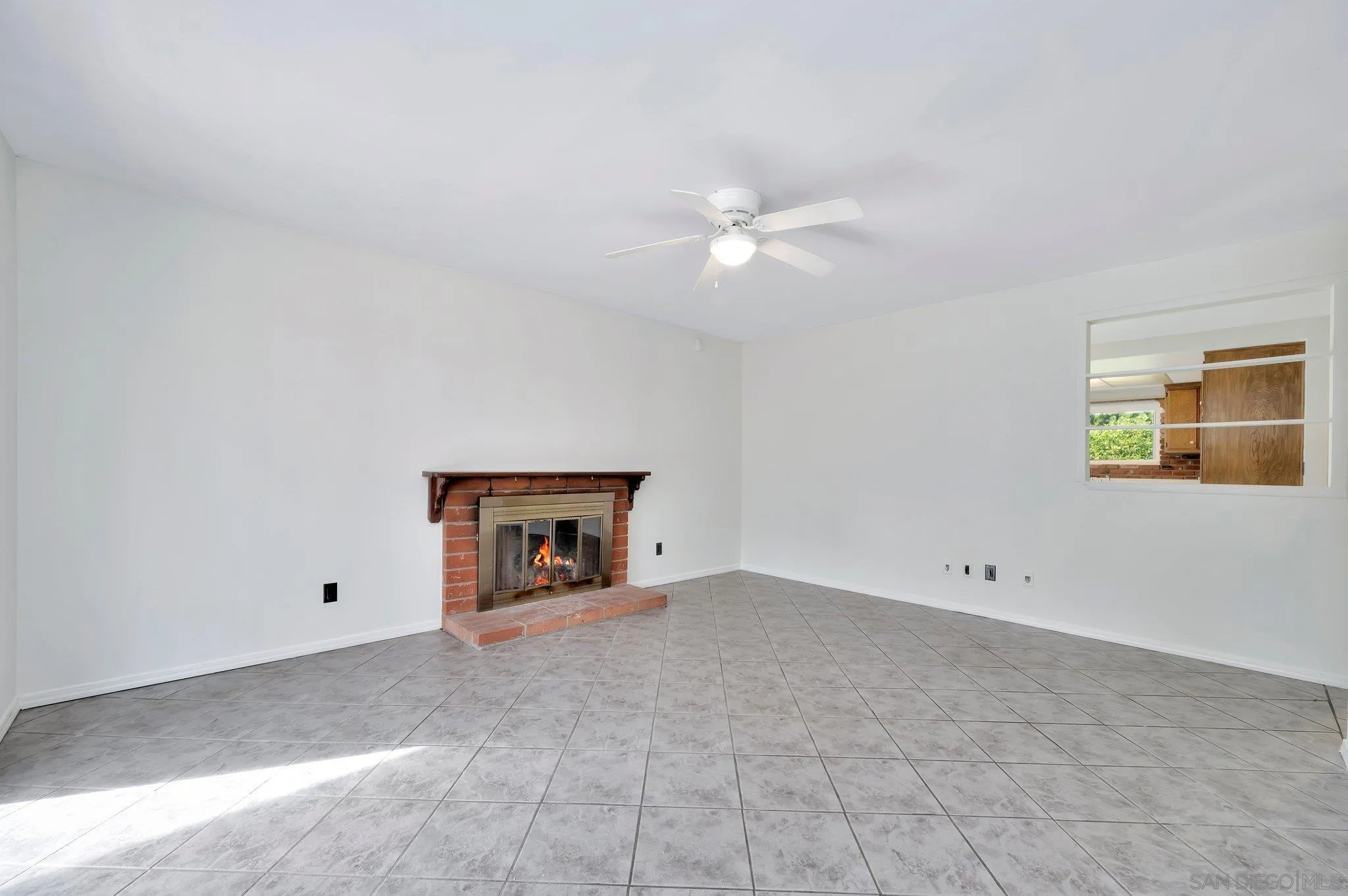 9183 Via De Amor Santee, CA 92071 - Photo 10 of 32 a view of an empty room with a ceiling fan and a window