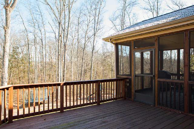 5524 Rathkeale Lane Franklin, TN 37067 - Photo 2 of 20 Enjoy this incredible setting on your amazing screened-in porch. Lovely views of adjoining acreage & wooded common area. Extended deck is a few steps away for grilling & outdoor entertaining.