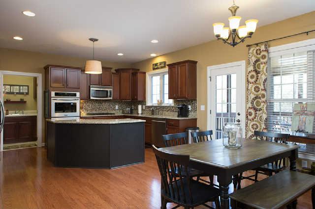 5524 Rathkeale Lane Franklin, TN 37067 - Photo 12 of 20 Gorgeous spacious kitchen is the heart of the home. Stainless appliances remain including new double ovens, new dishwasher, microwave, refrigerator, gas cook-top. "Back stairs" (second set of stairs) leading upstairs is located off kitchen as well.