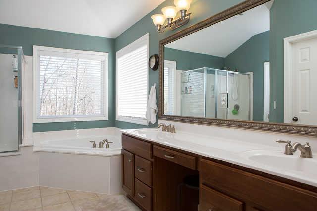 5524 Rathkeale Lane Franklin, TN 37067 - Photo 14 of 20 Master Bath is spacious with raised dual sinks, large walk-in closet (one of two walk-in closets in the master bedroom suite), a linen closet, a separate garden tub and a separate shower. Tile ceramic flooring and lots of bright natural lighting!