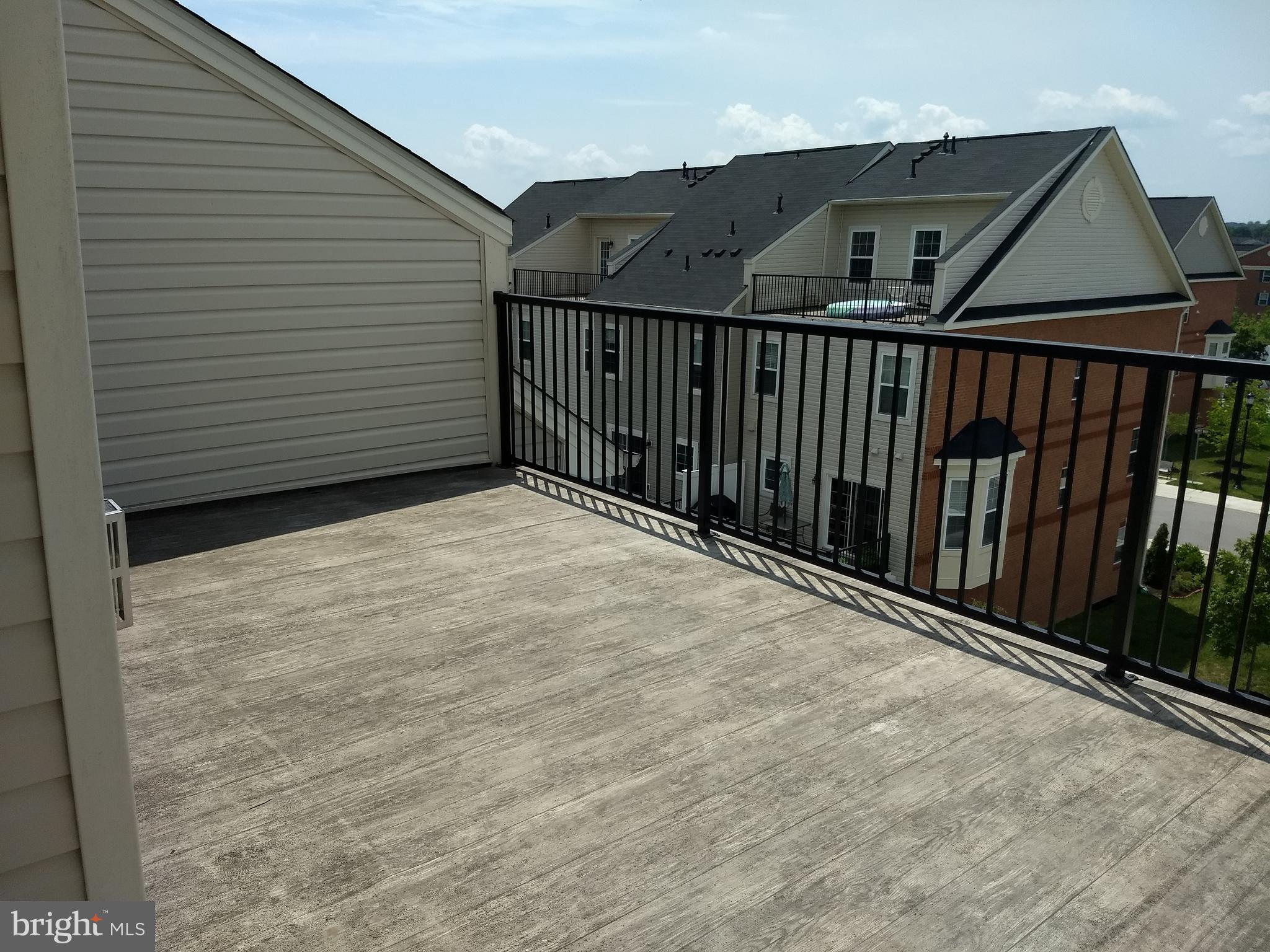 8010 Ravenclaw Road Elkridge, MD 21075 - Photo 12 of 30 4th Floor Loft has vinyl deck, with privacy wall