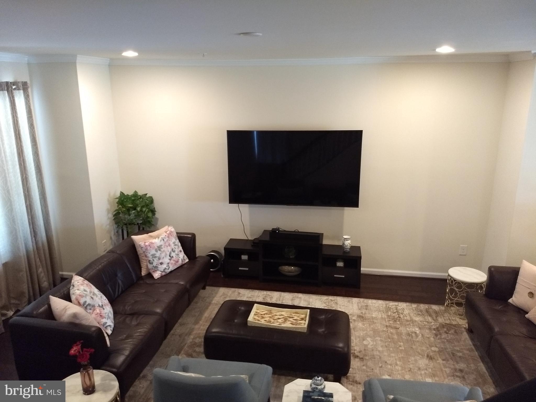 8010 Ravenclaw Road Elkridge, MD 21075 - Photo 7 of 30 Family Room has wall-mount LED TV