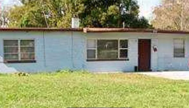 a view of swimming pool with a yard