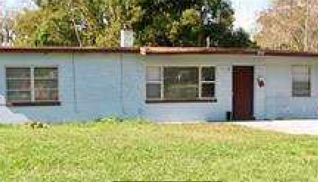 a view of swimming pool with a yard