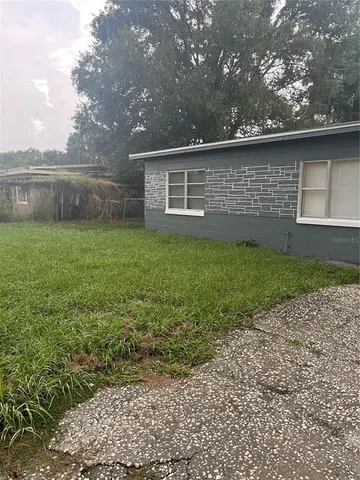 a backyard of a house with lots of green space