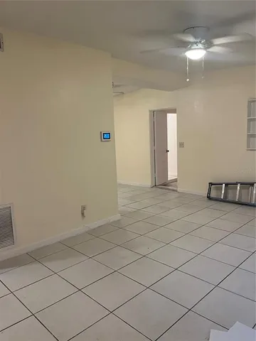 an empty room with a mirror