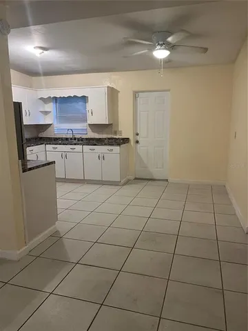 a kitchen with cabinets and appliances