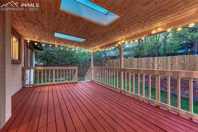 26 Mountain View Road Manitou Springs, CO 80829 - Photo 39 of 48 Newly painted covered back deck with skylights overlook the backyard
