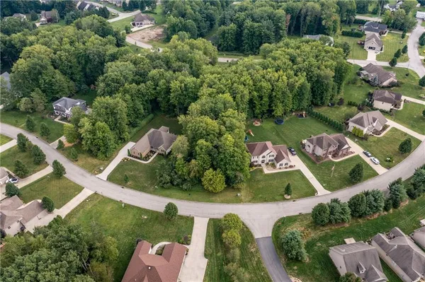 an aerial view of residential house with outdoor space and street view