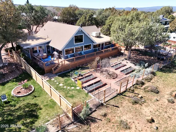 an aerial view of a house with a garden