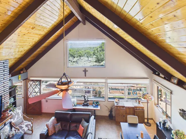 a room with furniture and a large window