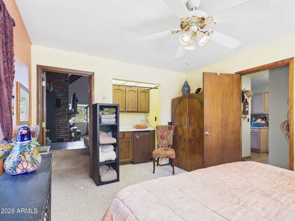 a bedroom with furniture and a chandelier
