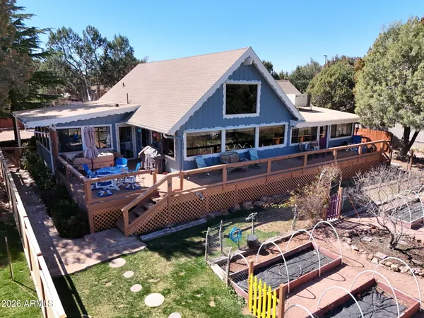 aerial view of a house with swimming pool and chairs