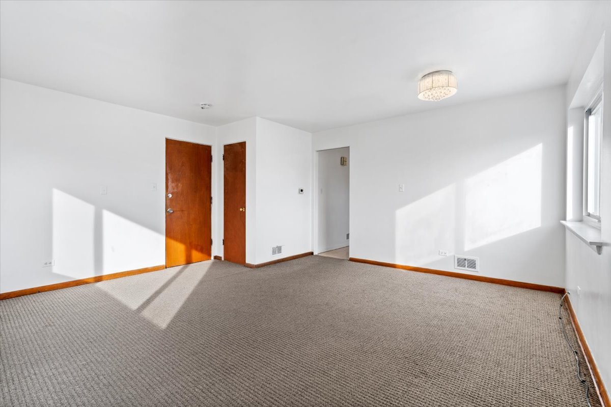 852 East 88th Place Chicago, IL 60619 - Photo 12 of 28 a view of an empty room with a window