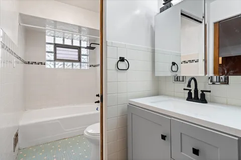 a bathroom with a sink a toilet and a bathtub