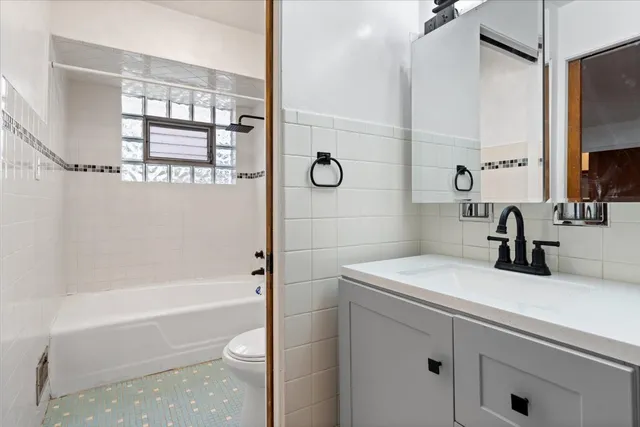 a bathroom with a sink a toilet and a bathtub