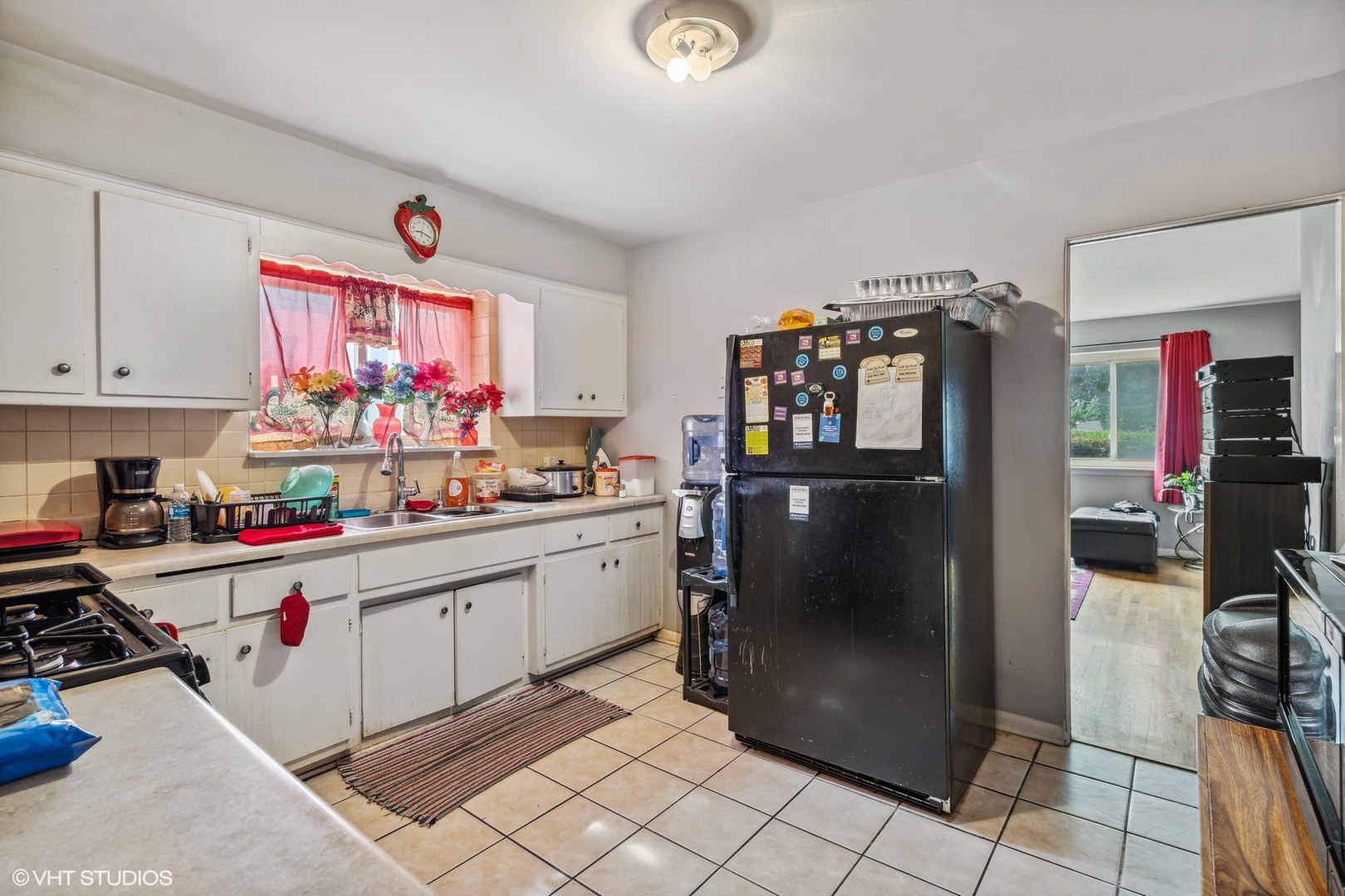 852 East 88th Place Chicago, IL 60619 - Photo 6 of 28 a kitchen with refrigerator and cabinets