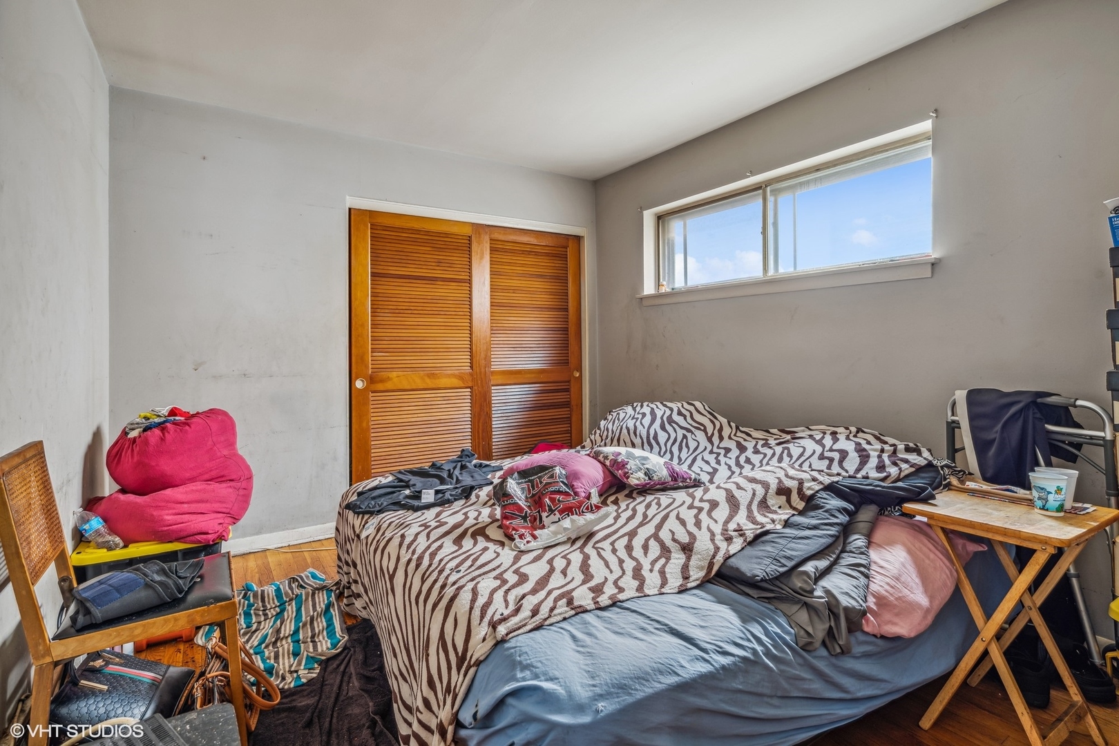852 East 88th Place Chicago, IL 60619 - Photo 8 of 28 a bedroom with a bed and wooden floor