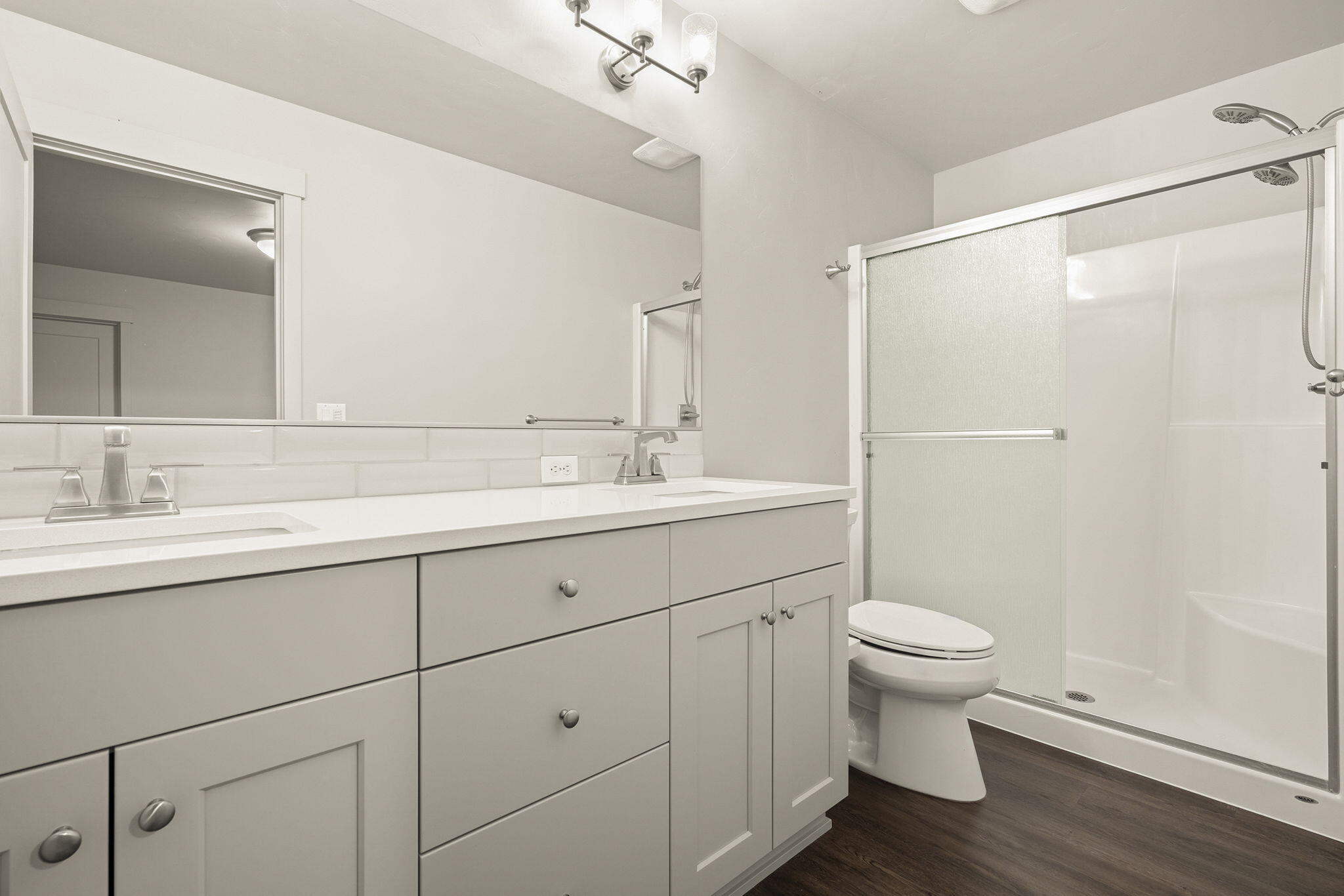 2366 Northeast Victor Place Bend, OR 97701 - Photo 19 of 31 a bathroom with a sink toilet a mirror and shower