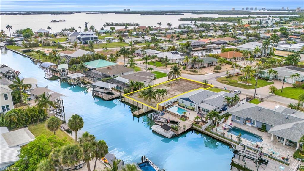231 Albatross Street Fort Myers Beach, FL 33931 - Photo 12 of 18 an aerial view of residential houses with outdoor space