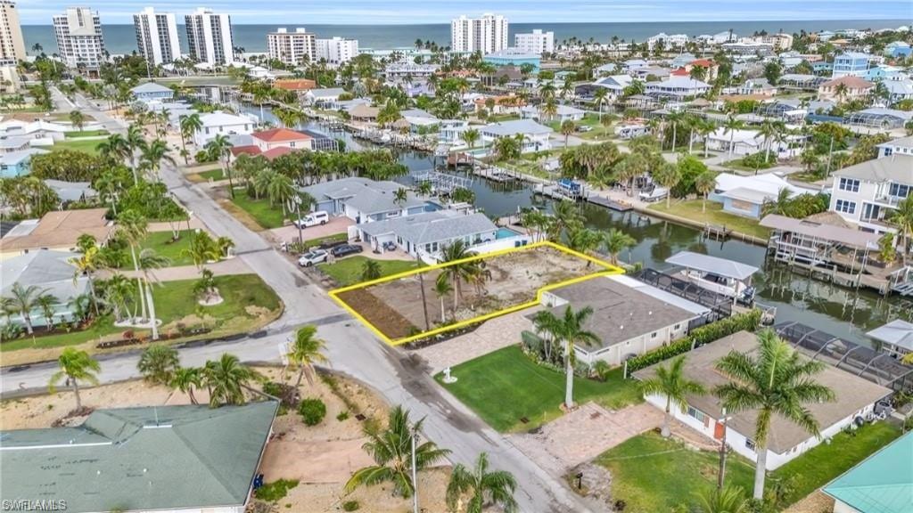 231 Albatross Street Fort Myers Beach, FL 33931 - Photo 17 of 18 an aerial view of residential houses with outdoor space