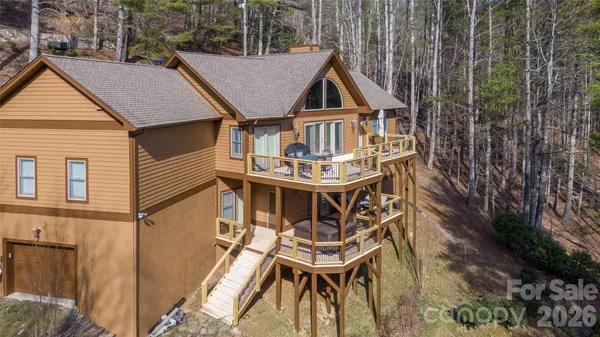 a aerial view of a house with roof deck front of house