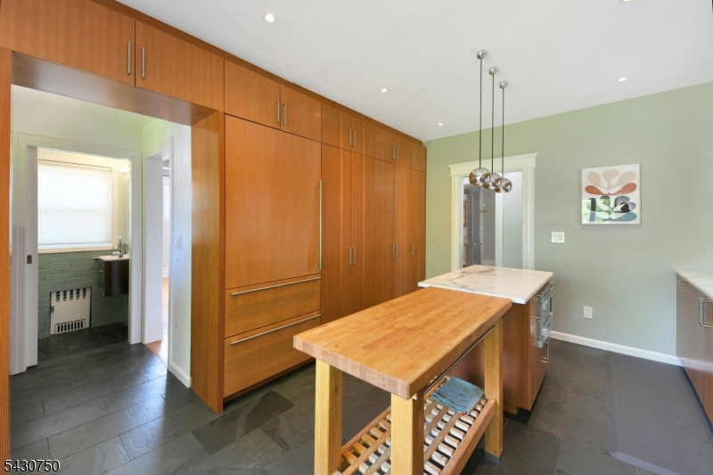 42 Norman Road Montclair, NJ 07043 - Photo 16 of 33 a view of a hallway with furniture and kitchen view