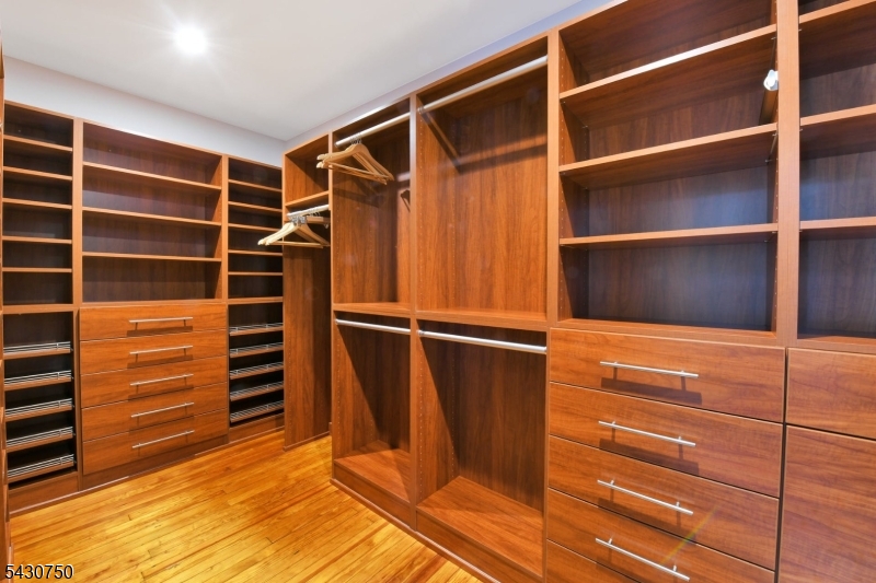 42 Norman Road Montclair, NJ 07043 - Photo 18 of 33 a view of walk in closet with empty racks