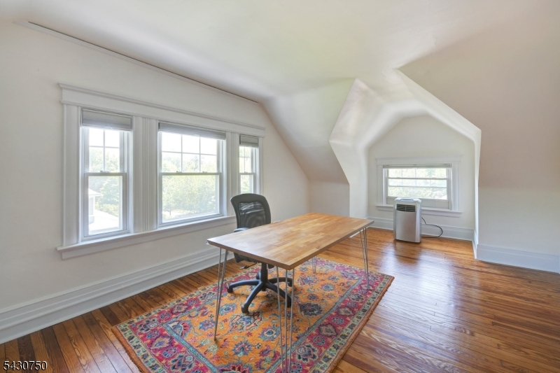 42 Norman Road Montclair, NJ 07043 - Photo 25 of 33 a workspace with wooden floor and a rug