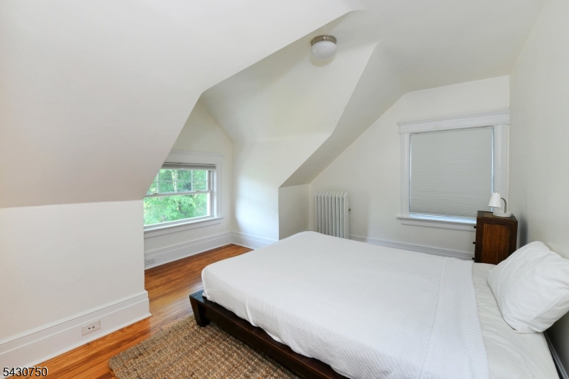 42 Norman Road Montclair, NJ 07043 - Photo 26 of 33 a bedroom with a bed and a window