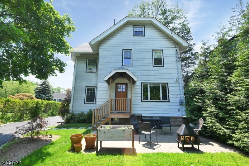 42 Norman Road Montclair, NJ 07043 - Photo 29 of 33 a front view of a house with garden and porch
