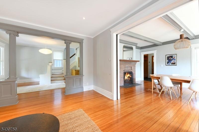 42 Norman Road Montclair, NJ 07043 - Photo 9 of 33 a view of a livingroom with furniture wooden floor and a fireplace