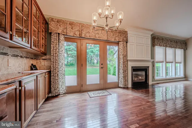 a kitchen with a refrigerator a stove top oven a sink dishwasher and wooden cabinets