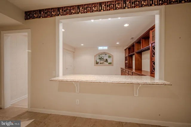 a view of an empty room with a cabinet