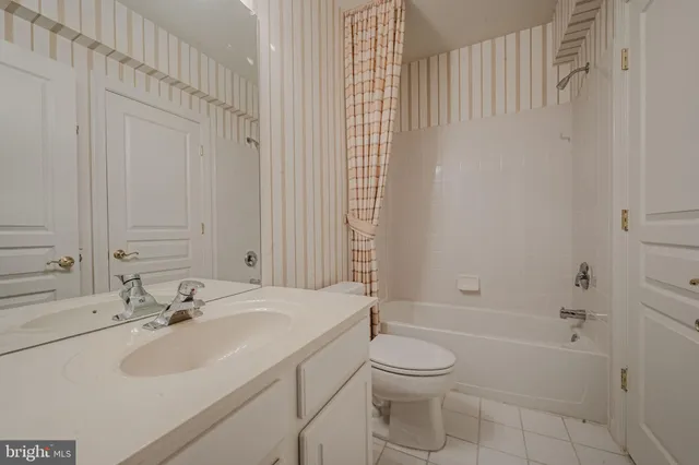 a view of a livingroom with furniture and cabinet