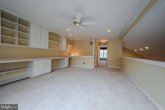 a view of an empty room and a window