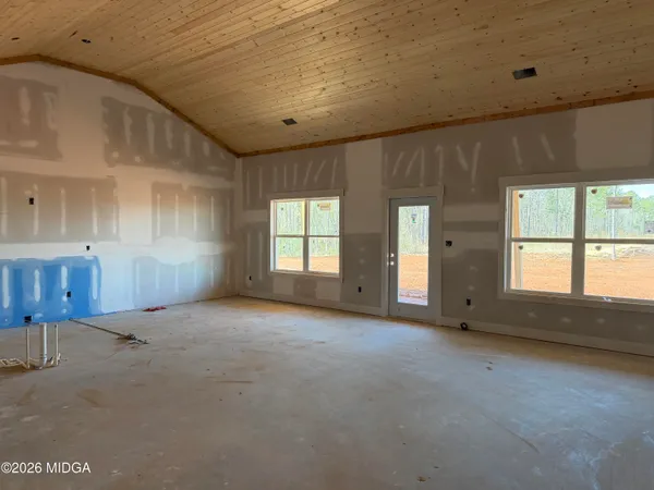 an empty room with windows