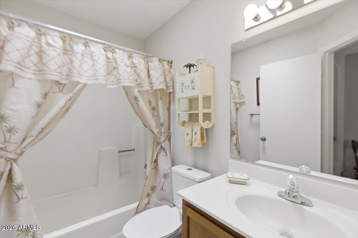 14300 West Bell Road, Unit 211 Surprise, AZ 85374 - Photo 25 of 42 a bathroom with a sink toilet and shower