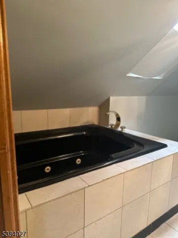 a view of a hallway with washer and dryer