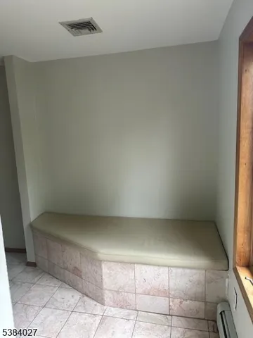 a bathroom with a glass shower door