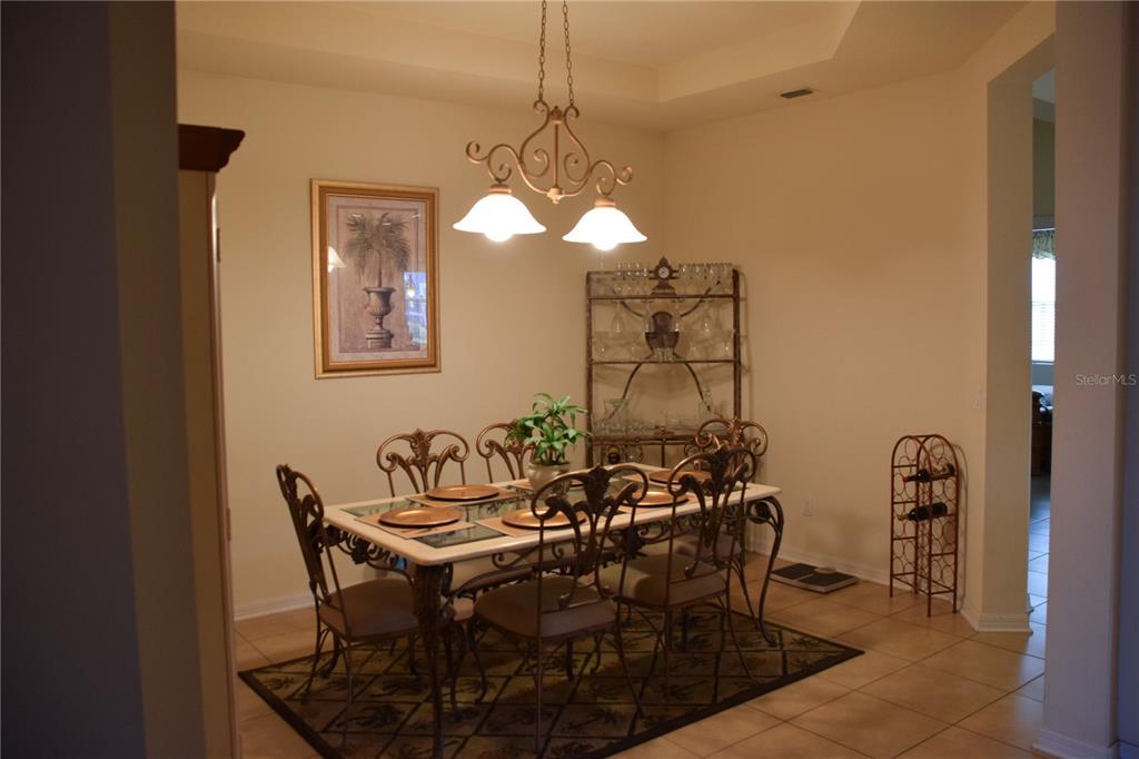 3500 Sprite Lane St. Cloud, FL 34772 - Photo 11 of 52 a table and chairs in a room