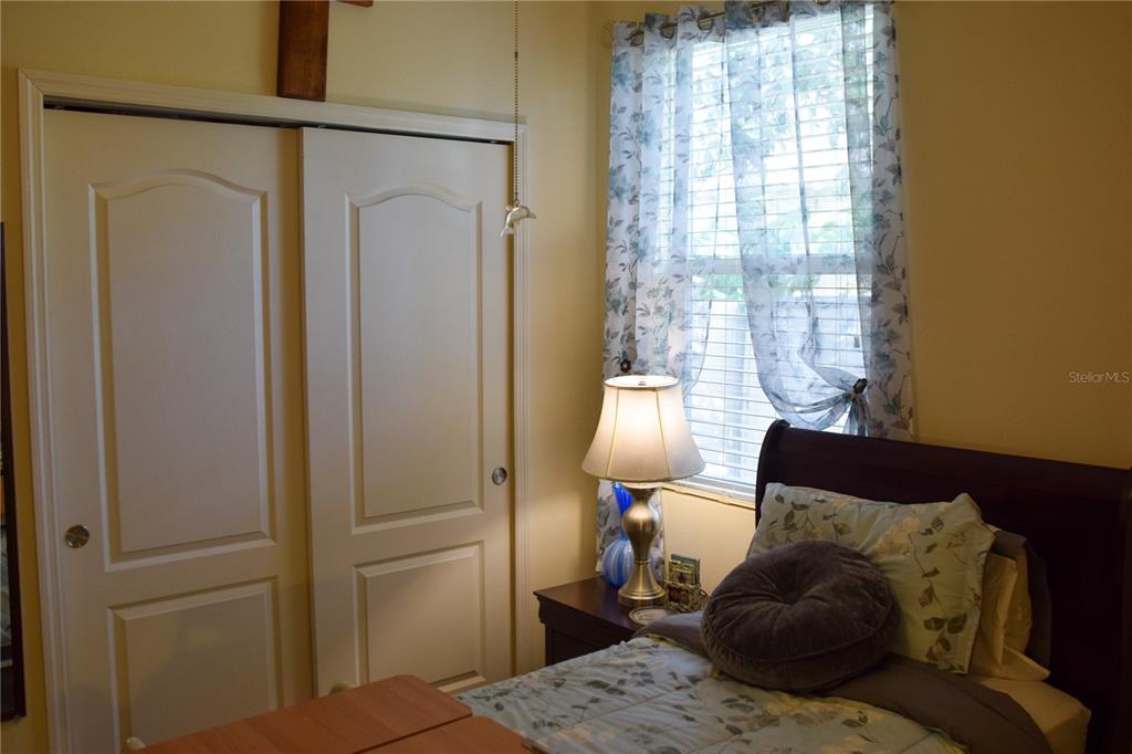 3500 Sprite Lane St. Cloud, FL 34772 - Photo 20 of 52 a bedroom with a bed and wooden floor