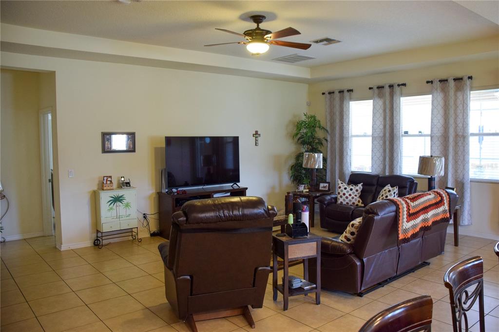 3500 Sprite Lane St. Cloud, FL 34772 - Photo 22 of 52 a living room with furniture and a flat screen tv