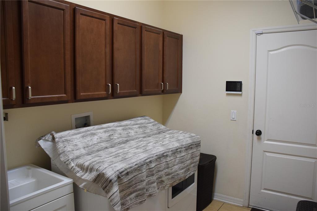 3500 Sprite Lane St. Cloud, FL 34772 - Photo 29 of 52 a bed sitting in a kitchen next to a cabinet
