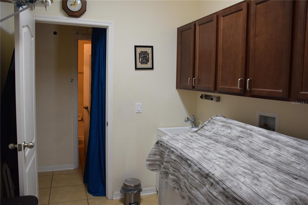3500 Sprite Lane St. Cloud, FL 34772 - Photo 30 of 52 a bed room with a bed and mirror