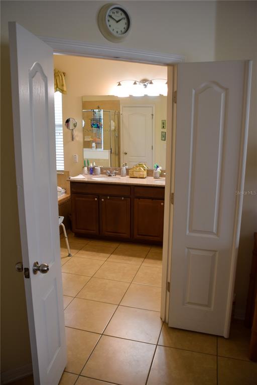 3500 Sprite Lane St. Cloud, FL 34772 - Photo 36 of 52 a large bathroom with a glass door shower and sink