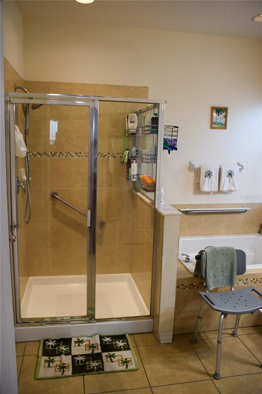 3500 Sprite Lane St. Cloud, FL 34772 - Photo 37 of 52 a bathroom with a sink mirror toilet and shower