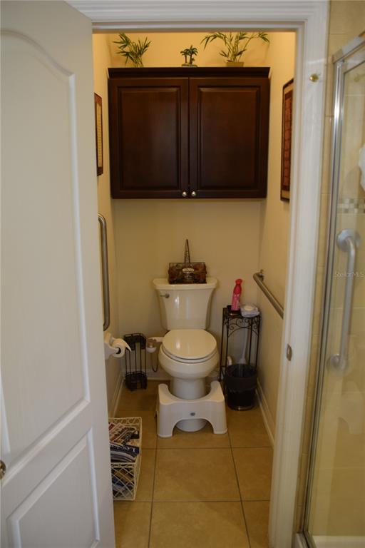 3500 Sprite Lane St. Cloud, FL 34772 - Photo 38 of 52 a bathroom with a toilet a sink and a mirror
